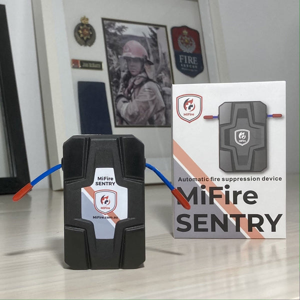 MiFire Sentry wireless automatic fire extinguisher front view with Fire Fighter picture in background. MiFire Australia.